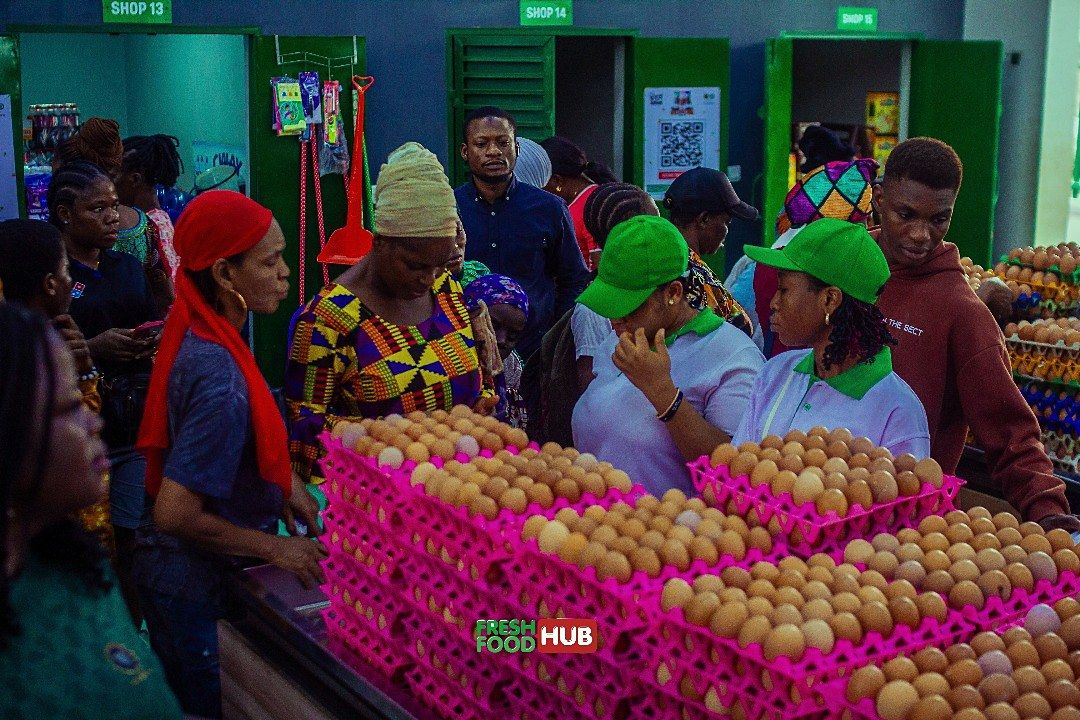 Rhyss Farms staff in green caps checking eggs for customers.